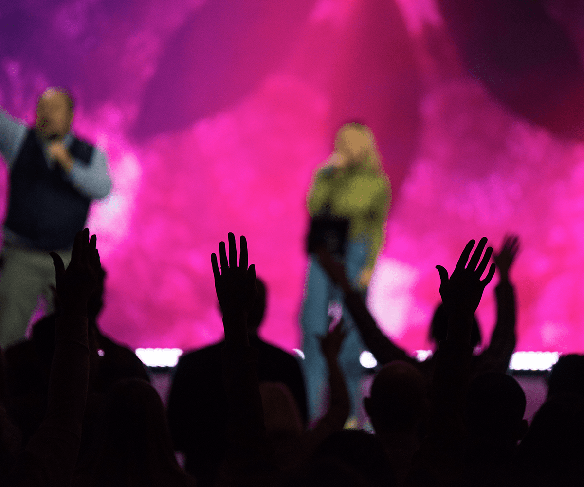 People's hands up in a Grace Chapel worship service